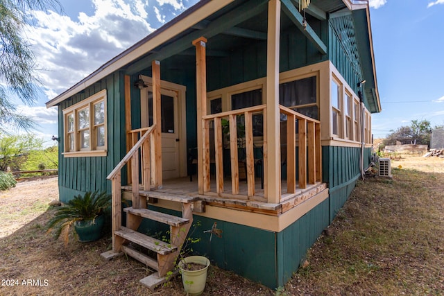 back of property featuring central air condition unit