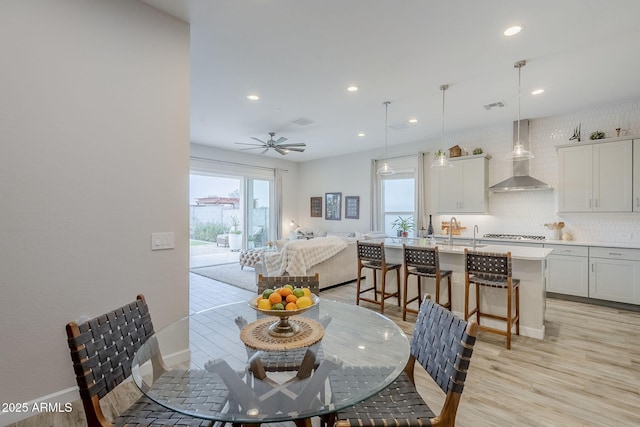 10509 W Harmony Ln, Peoria, AZ 85382 - dining room featuring light wood finished floors, recessed lighting, baseboards, and a ceiling fan