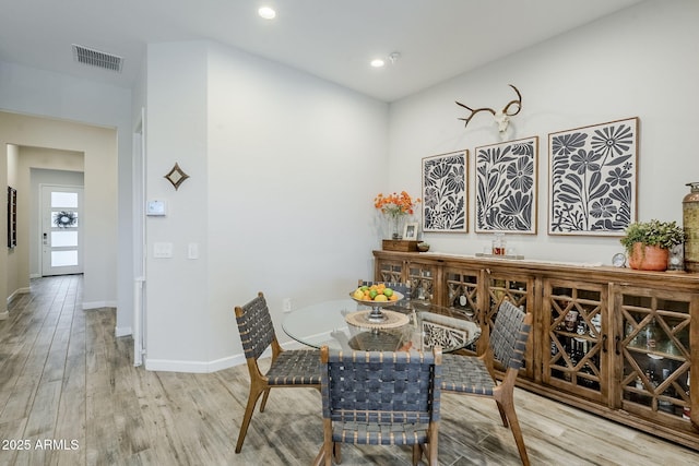 10509 W Harmony Ln, Peoria, AZ 85382 - dining room with wood finished floors, baseboards, and recessed lighting
