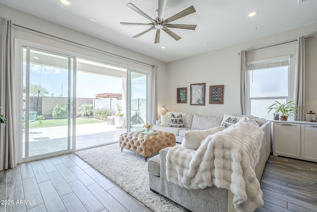 10509 W Harmony Ln, Peoria, AZ 85382 - living area featuring a ceiling fan, wood finished floors, and recessed lighting