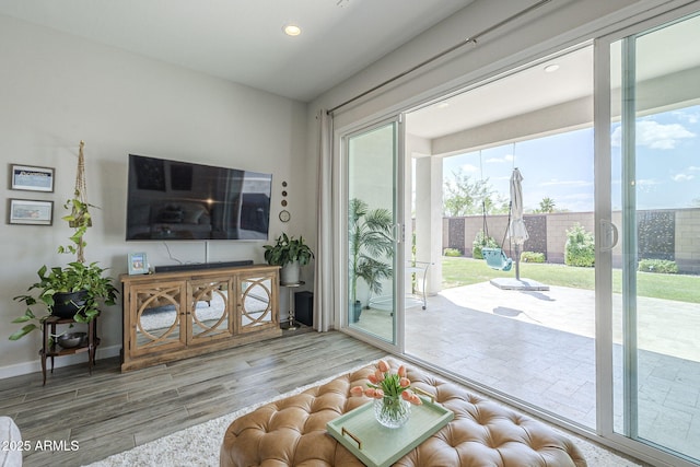 10509 W Harmony Ln, Peoria, AZ 85382 - living area featuring wood finished floors, recessed lighting, and baseboards