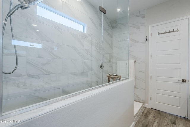 10509 W Harmony Ln, Peoria, AZ 85382 - full bath with a marble finish shower and wood finished floors
