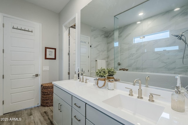 10509 W Harmony Ln, Peoria, AZ 85382 - full bath featuring wood finished floors, a stall shower, and double vanity