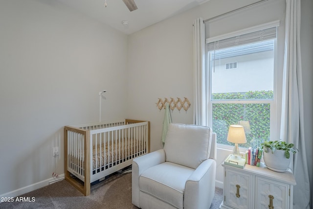 10509 W Harmony Ln, Peoria, AZ 85382 - bedroom featuring carpet flooring, a crib, and baseboards