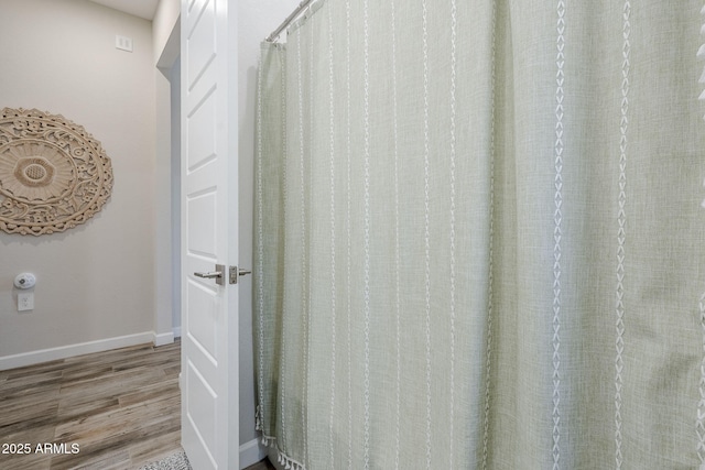 10509 W Harmony Ln, Peoria, AZ 85382 - bathroom featuring wood finished floors and baseboards