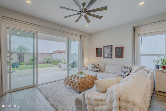 10509 W Harmony Ln, Peoria, AZ 85382 - living area featuring light wood-style flooring, a ceiling fan, and recessed lighting