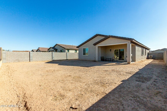 back of house with a patio area