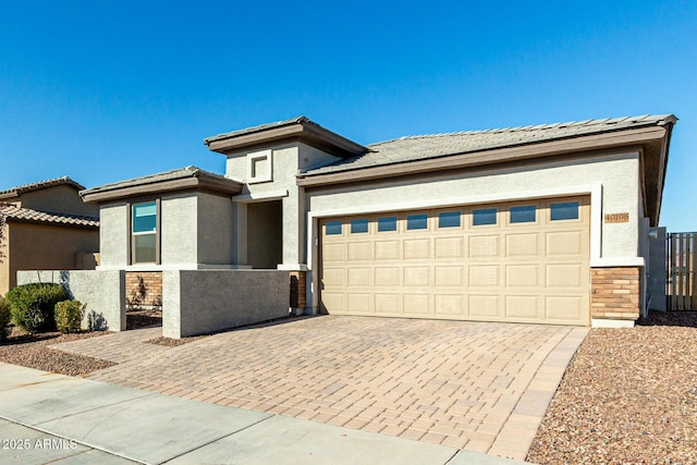 prairie-style house featuring a garage