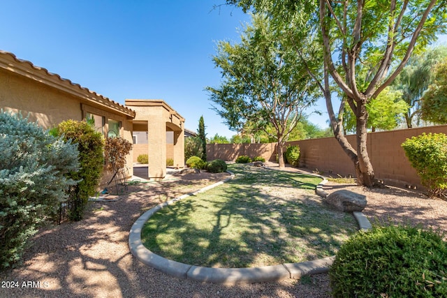 view of yard with a fenced backyard