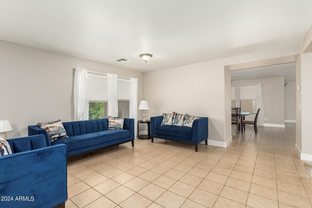 living room featuring light tile patterned flooring