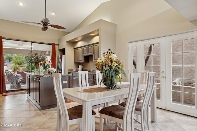 dining area featuring light tile patterned flooring, recessed lighting, french doors, and high vaulted ceiling