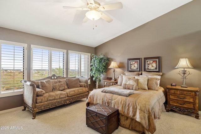 carpeted bedroom with baseboards, lofted ceiling, and a ceiling fan