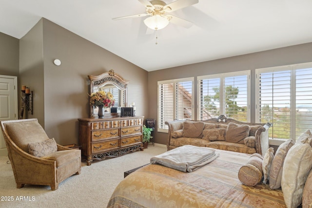 bedroom with vaulted ceiling, baseboards, carpet floors, and ceiling fan