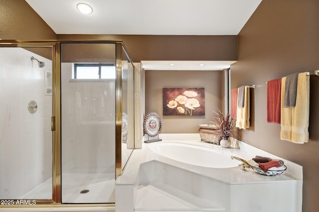 bathroom featuring a bath and a stall shower