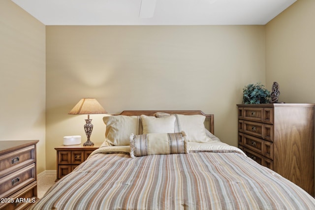 bedroom with baseboards and carpet floors