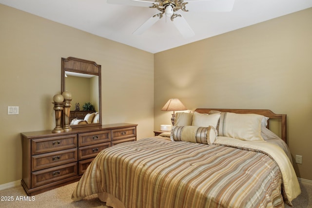 bedroom with baseboards, light carpet, and ceiling fan