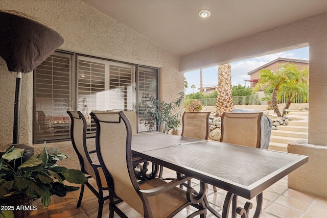 view of patio / terrace featuring outdoor dining area and fence