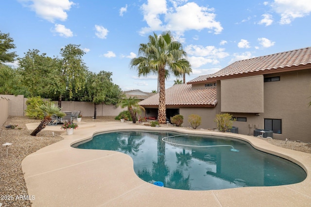 view of pool with a fenced in pool, a fenced backyard, and a patio area