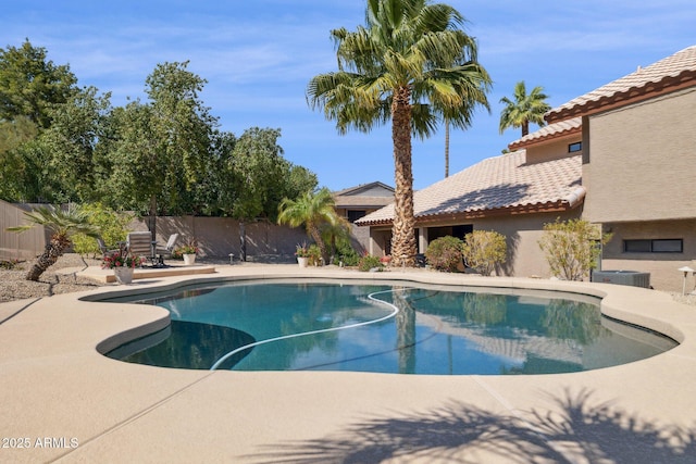 view of pool featuring a patio area, a fenced backyard, and a fenced in pool