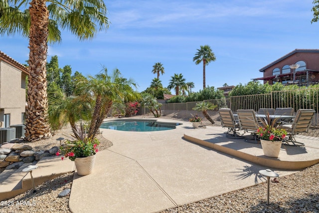 view of pool with a fenced in pool, a fenced backyard, and a patio area