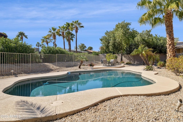 view of swimming pool featuring a fenced in pool, a patio, and a fenced backyard