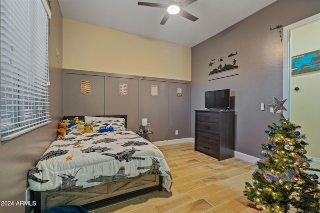 bedroom with light wood-type flooring, a closet, and ceiling fan