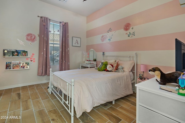 bedroom featuring light hardwood / wood-style floors