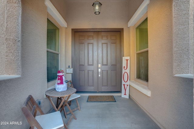 property entrance with covered porch