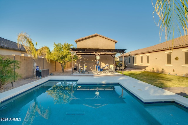 view of swimming pool featuring a lawn and a patio area