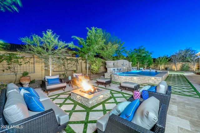 patio at twilight with a fenced in pool, an outdoor living space with a fire pit, and pool water feature