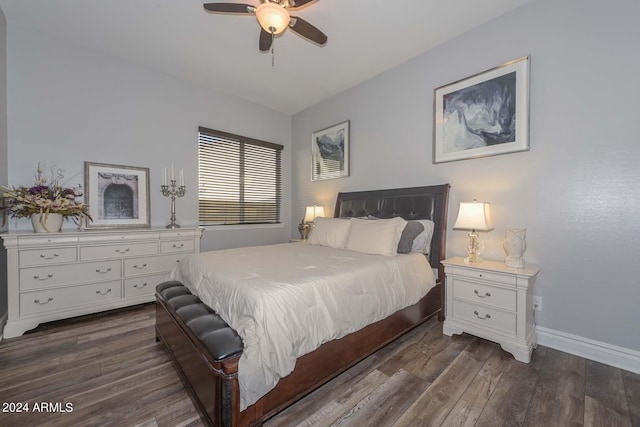 bedroom with dark hardwood / wood-style flooring and ceiling fan