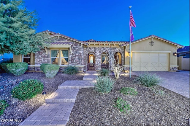 view of front of property featuring a garage