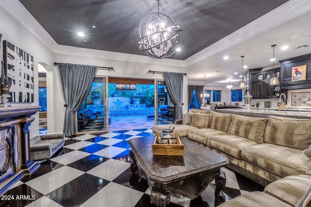 living room with ornamental molding and a chandelier