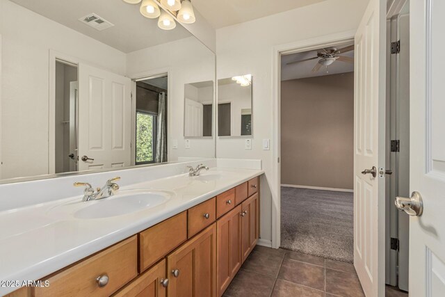 5752 S Crossbow Pl, Chandler, AZ 85249 - full bath with visible vents, a sink, ceiling fan, double vanity, and tile patterned floors
