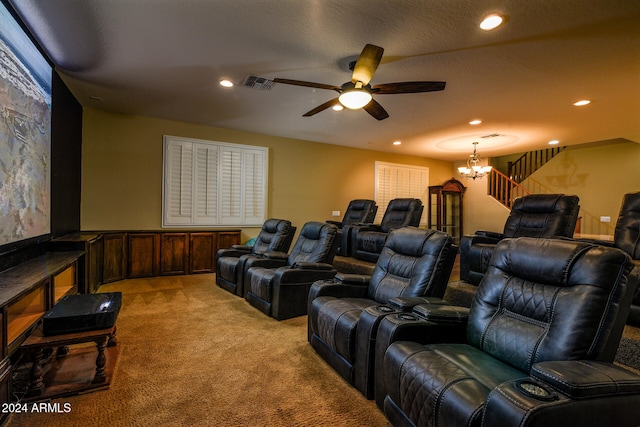 cinema with light colored carpet and ceiling fan with notable chandelier