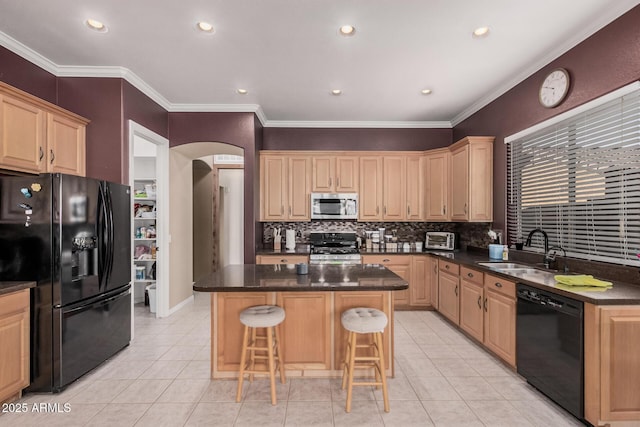 10529 E Posada Ave, Mesa, AZ 85212 - kitchen with black appliances, arched walkways, decorative backsplash, a kitchen bar, and a center island