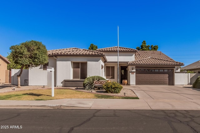 10529 E Posada Ave, Mesa, AZ 85212 - view of front of home with an attached garage, stucco siding, a tiled roof, and driveway