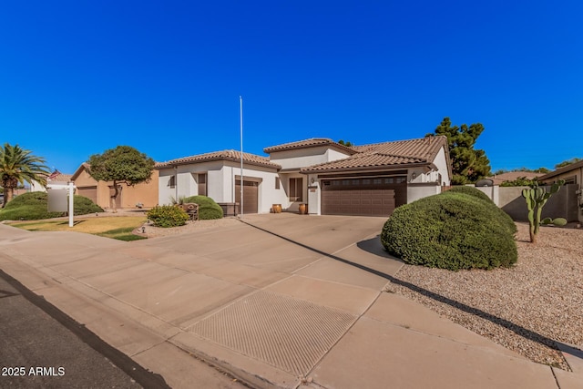 10529 E Posada Ave, Mesa, AZ 85212 - mediterranean / spanish house with an attached garage, stucco siding, a tiled roof, and driveway