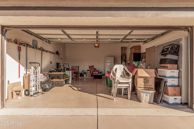 10529 E Posada Ave, Mesa, AZ 85212 - garage featuring freestanding refrigerator and water heater
