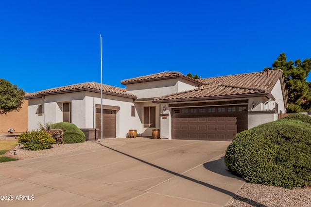 10529 E Posada Ave, Mesa, AZ 85212 - mediterranean / spanish home featuring an attached garage, driveway, stucco siding, and a tile roof