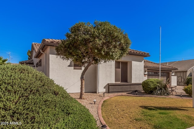 10529 E Posada Ave, Mesa, AZ 85212 - view of front facade featuring an attached garage, a tiled roof, and stucco siding