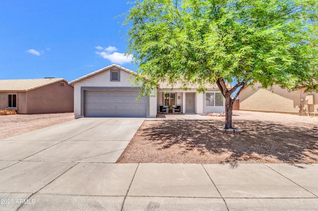 1858 S Ocotillo Dr, Apache Junction, AZ 85120 - view of front of house featuring a garage, concrete driveway, and stucco siding