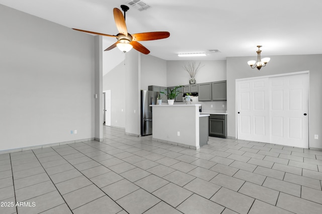 1858 S Ocotillo Dr, Apache Junction, AZ 85120 - unfurnished living room with high vaulted ceiling, a chandelier, ceiling fan, and light tile patterned flooring
