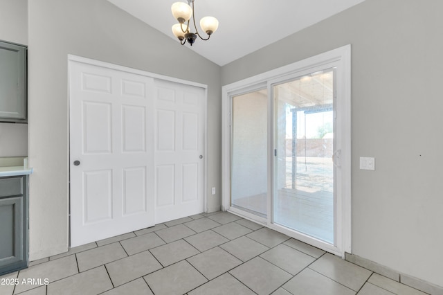 1858 S Ocotillo Dr, Apache Junction, AZ 85120 - unfurnished dining area featuring lofted ceiling, a chandelier, and light tile patterned floors