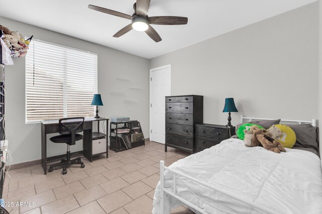 1858 S Ocotillo Dr, Apache Junction, AZ 85120 - bedroom featuring an office area, a ceiling fan, and light tile patterned floors