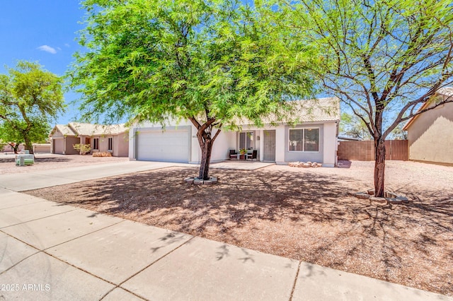 1858 S Ocotillo Dr, Apache Junction, AZ 85120 - view of front of property with a garage, concrete driveway, and stucco siding