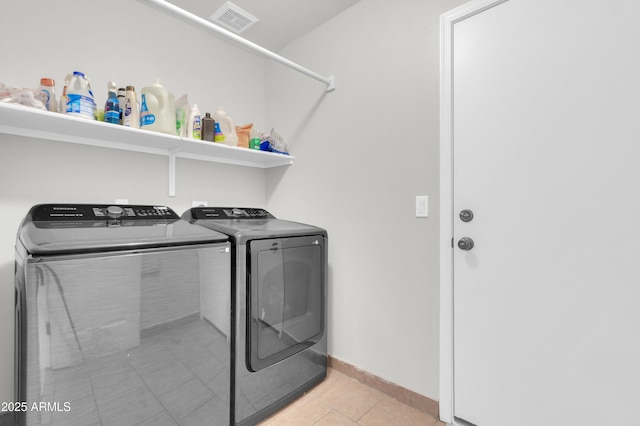 1858 S Ocotillo Dr, Apache Junction, AZ 85120 - laundry room with washer and dryer and light tile patterned flooring