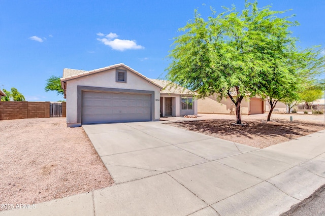 1858 S Ocotillo Dr, Apache Junction, AZ 85120 - ranch-style home with stucco siding, an attached garage, and concrete driveway