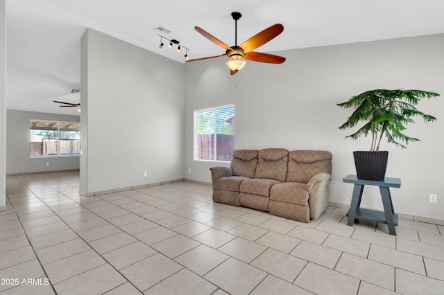 1858 S Ocotillo Dr, Apache Junction, AZ 85120 - living area featuring ceiling fan, track lighting, light tile patterned flooring, and a high ceiling