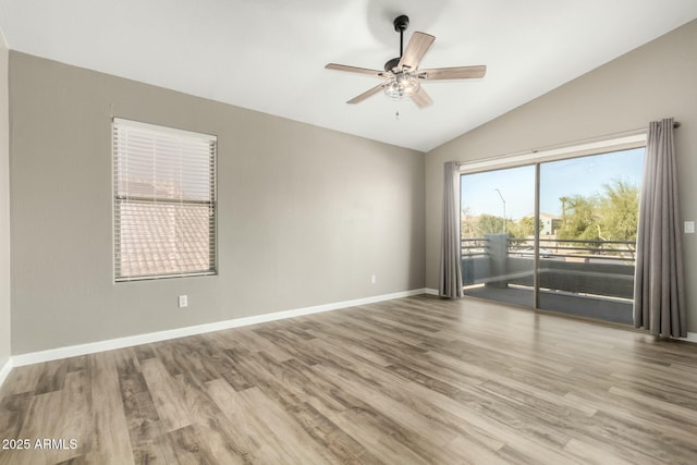 unfurnished room featuring ceiling fan, vaulted ceiling, and hardwood / wood-style flooring